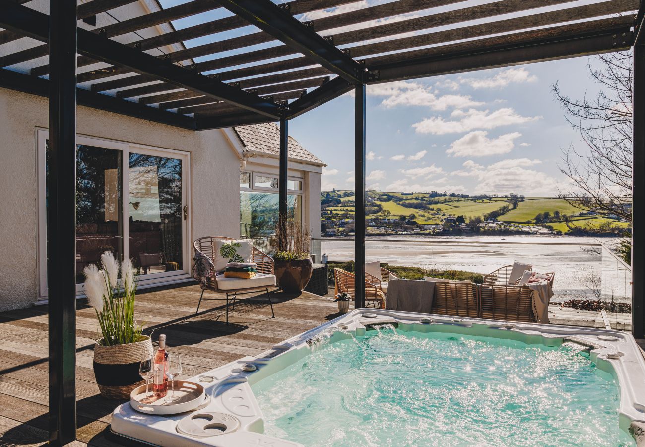 10-person Hydropool spa on a private deck overlooking the River Teign at a luxury Teignmouth holiday rental